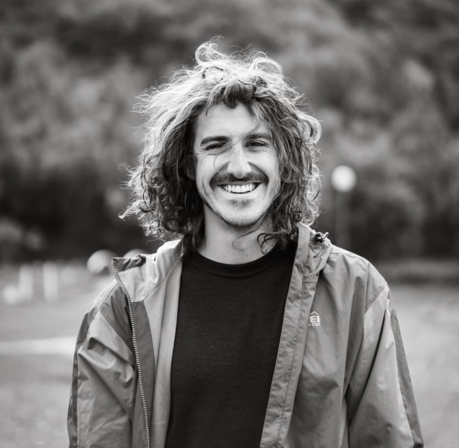 Hunter O'Brien, Tampa wedding photographer, smiling in a black and white portrait