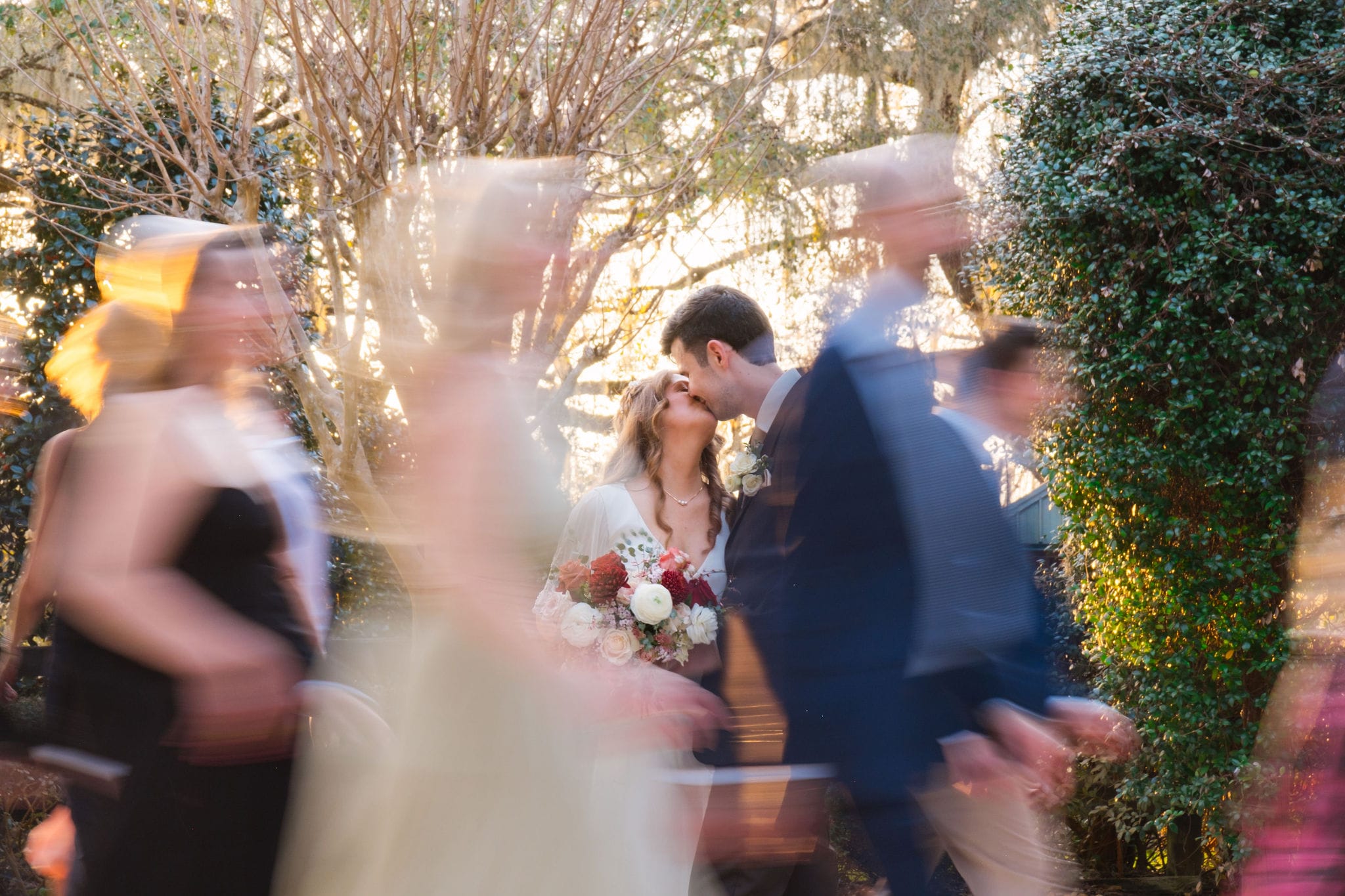 Couple kiss ghostly guests motion blur garden