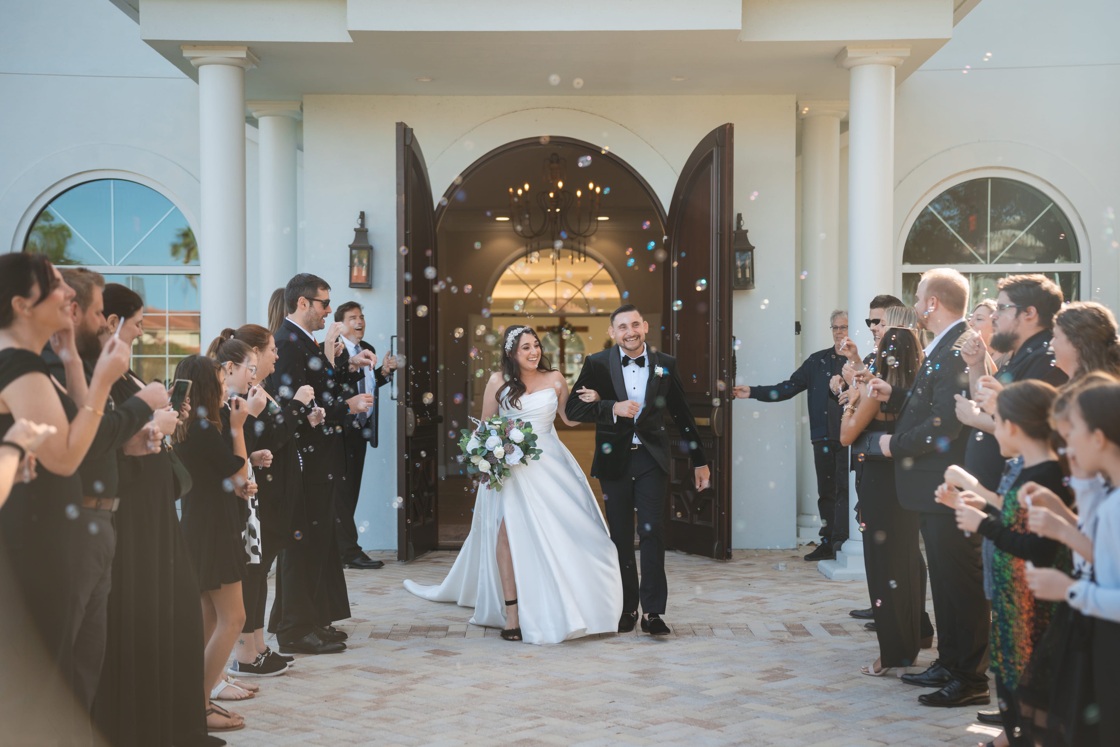 Newlyweds bubble exit white chapel