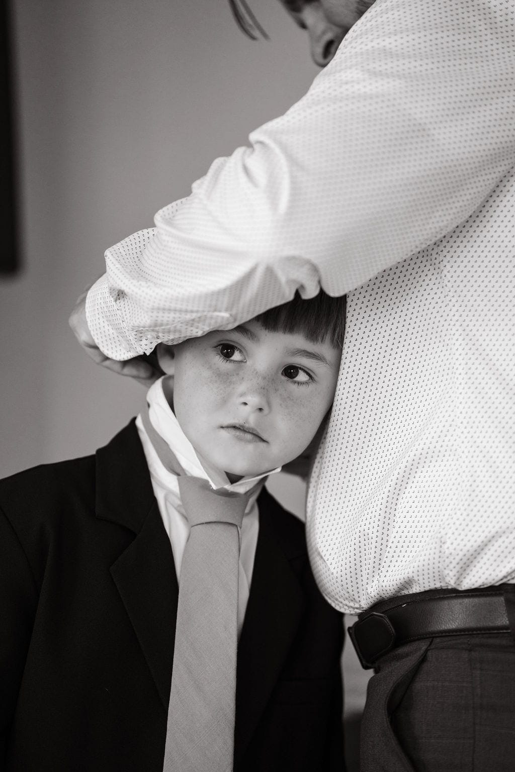 Ring bearer hair smoothed getting ready black and white