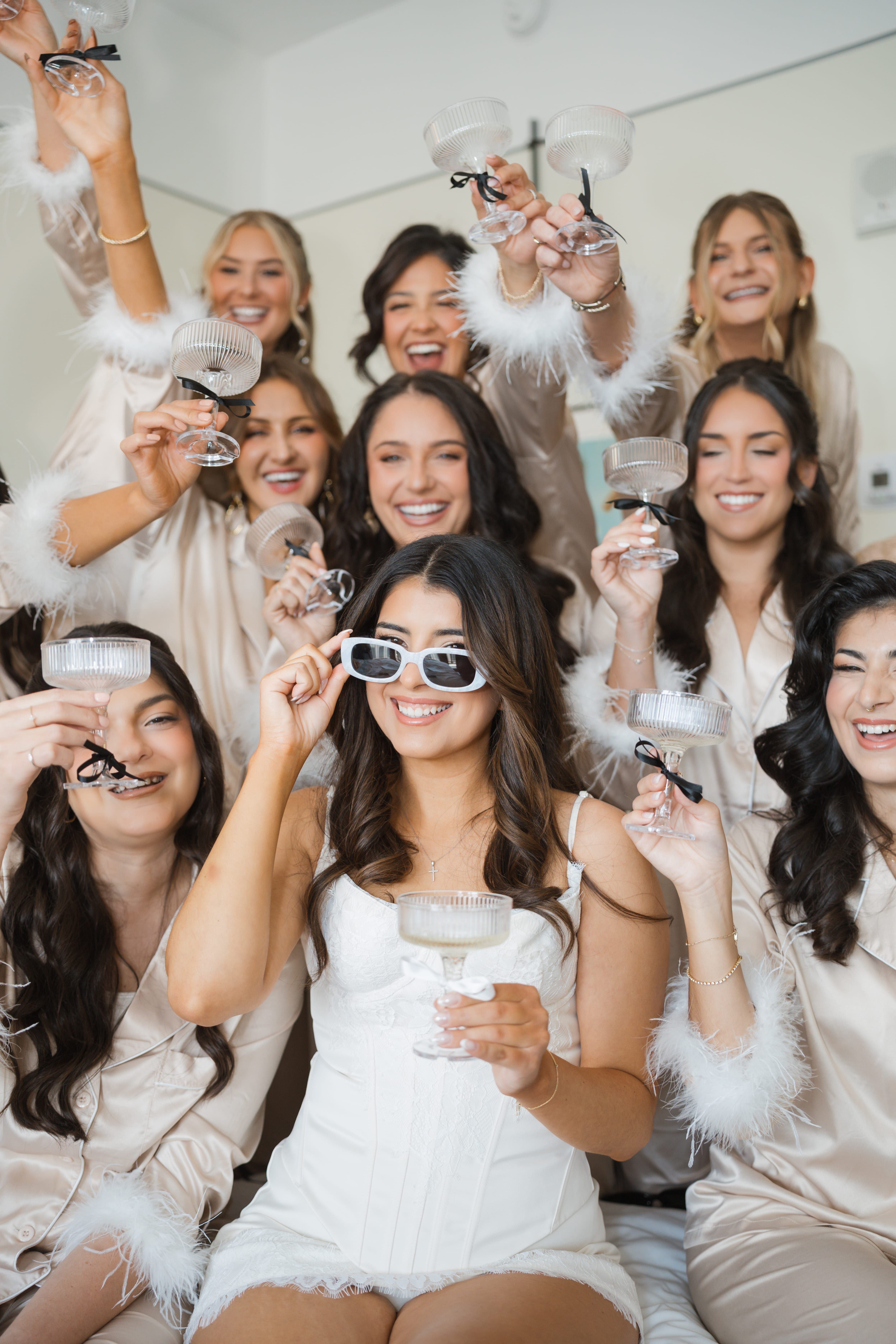 Bride bridesmaids pajamas champagne toast
