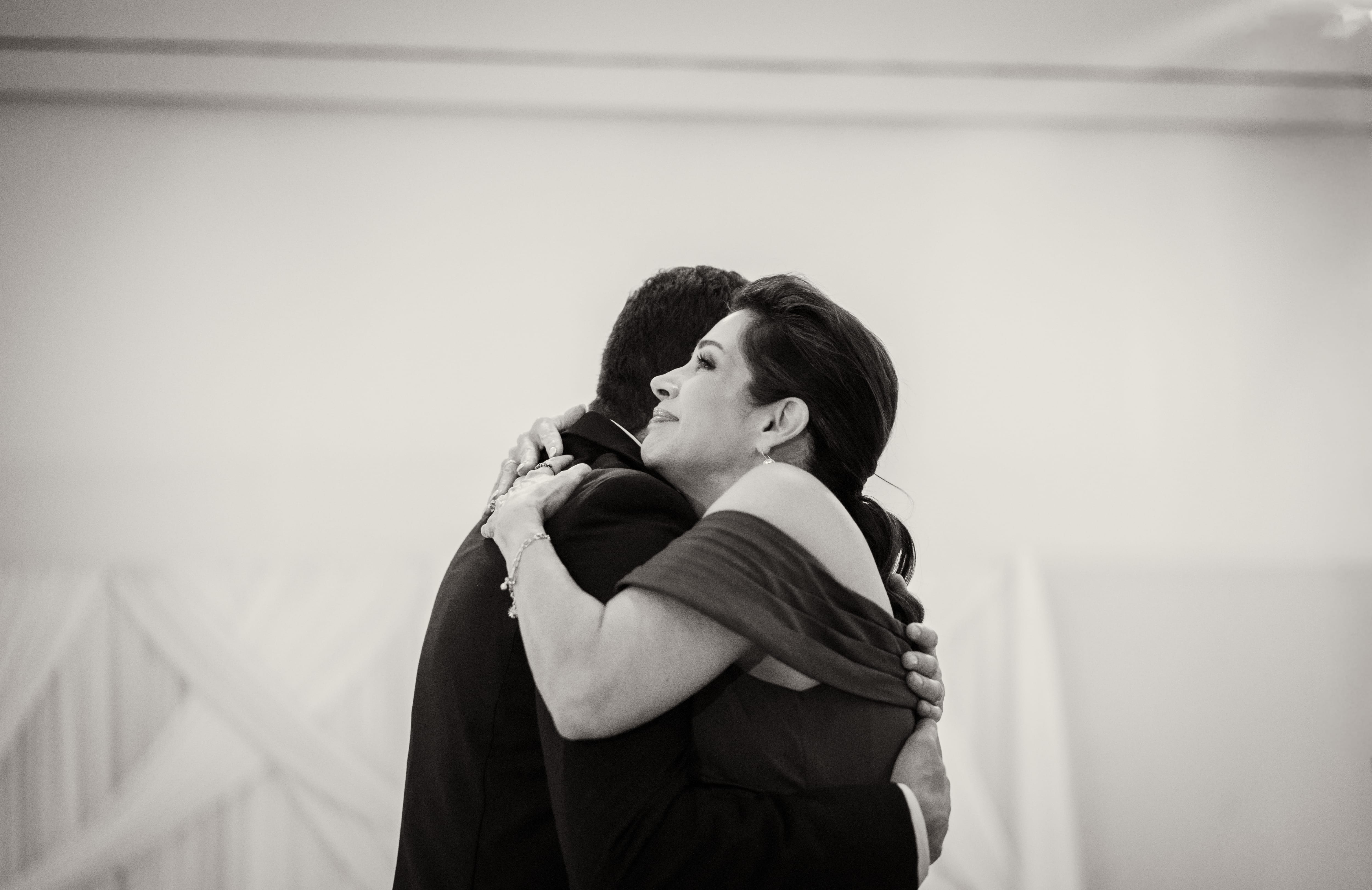 Black and white emotional mother hug