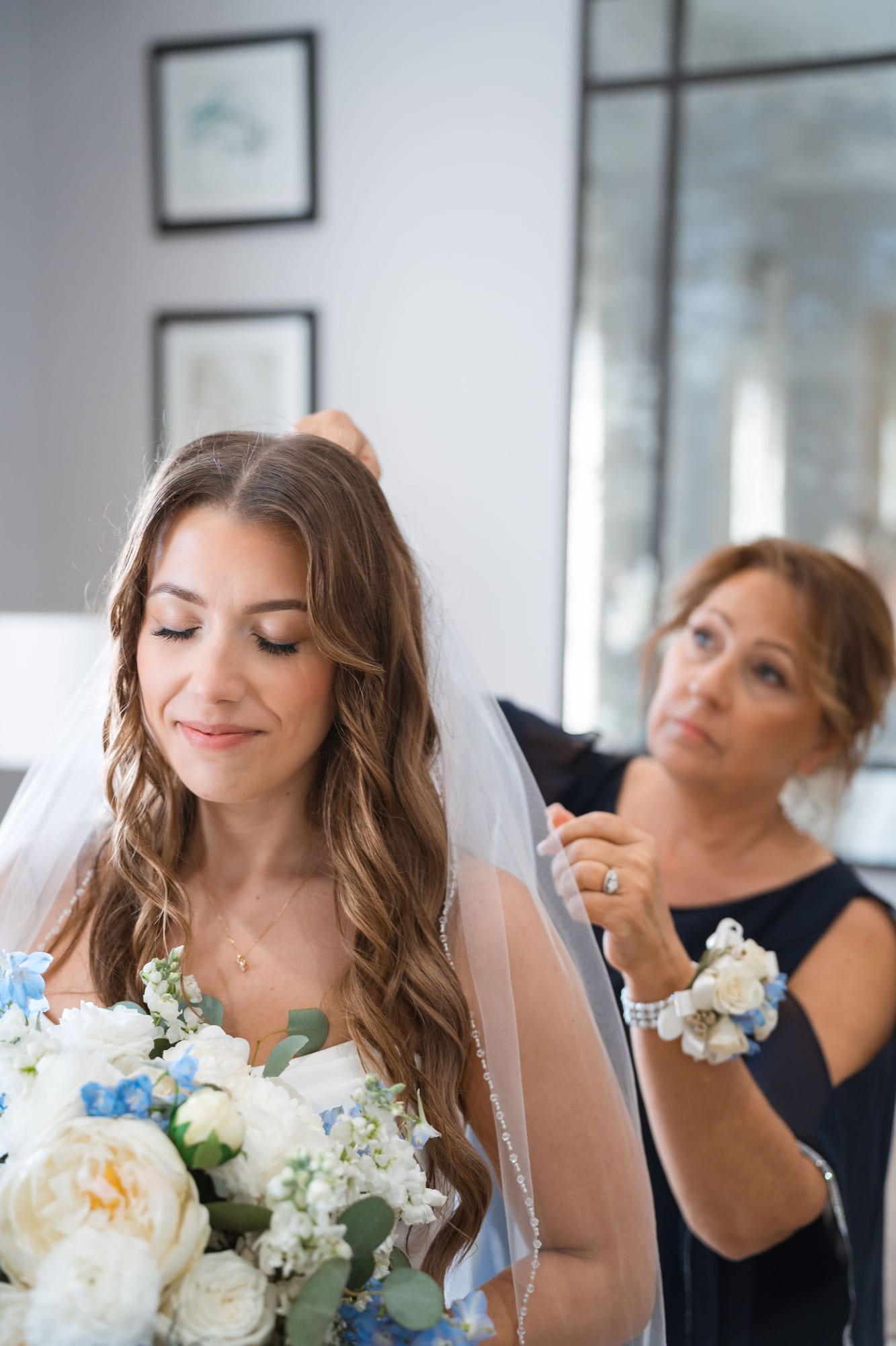 Bride sharing a quiet moment with her mother while getting ready