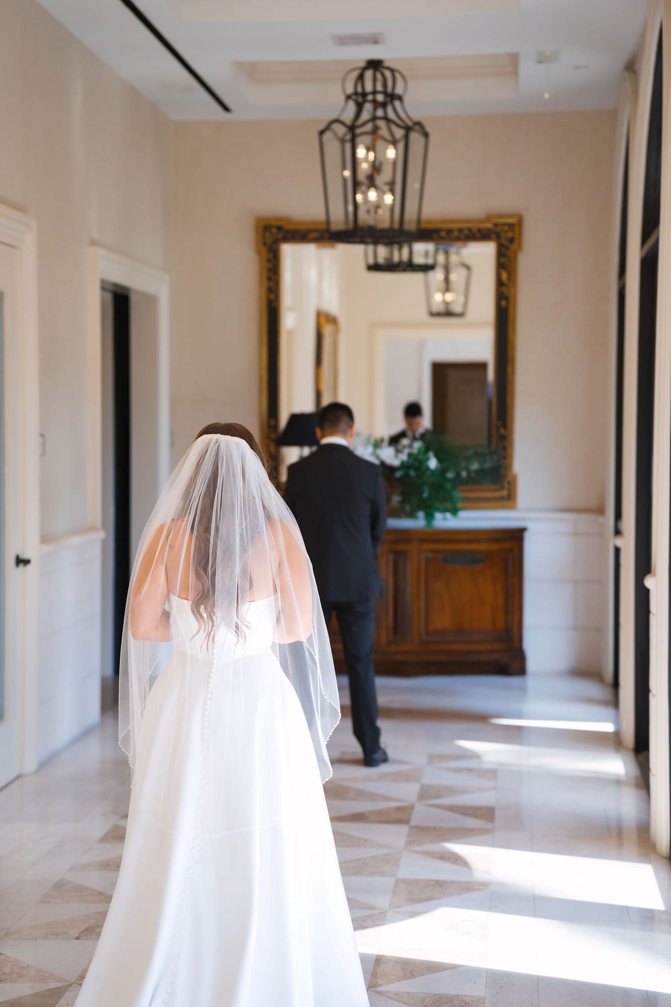 Bride walking down the arched clubhouse corridor at Lakewood Ranch Golf and Country Club
