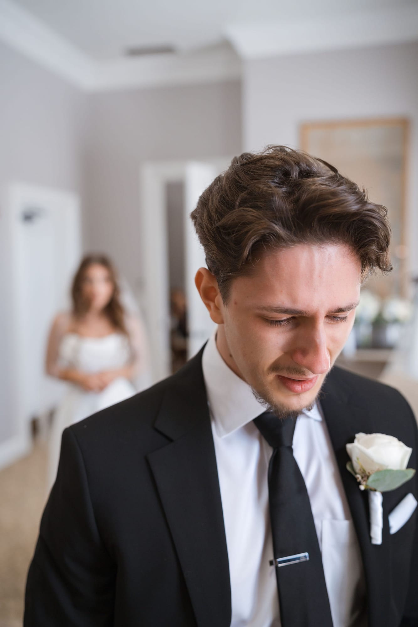 Bride's brother getting emotional during his first look with her on the wedding morning