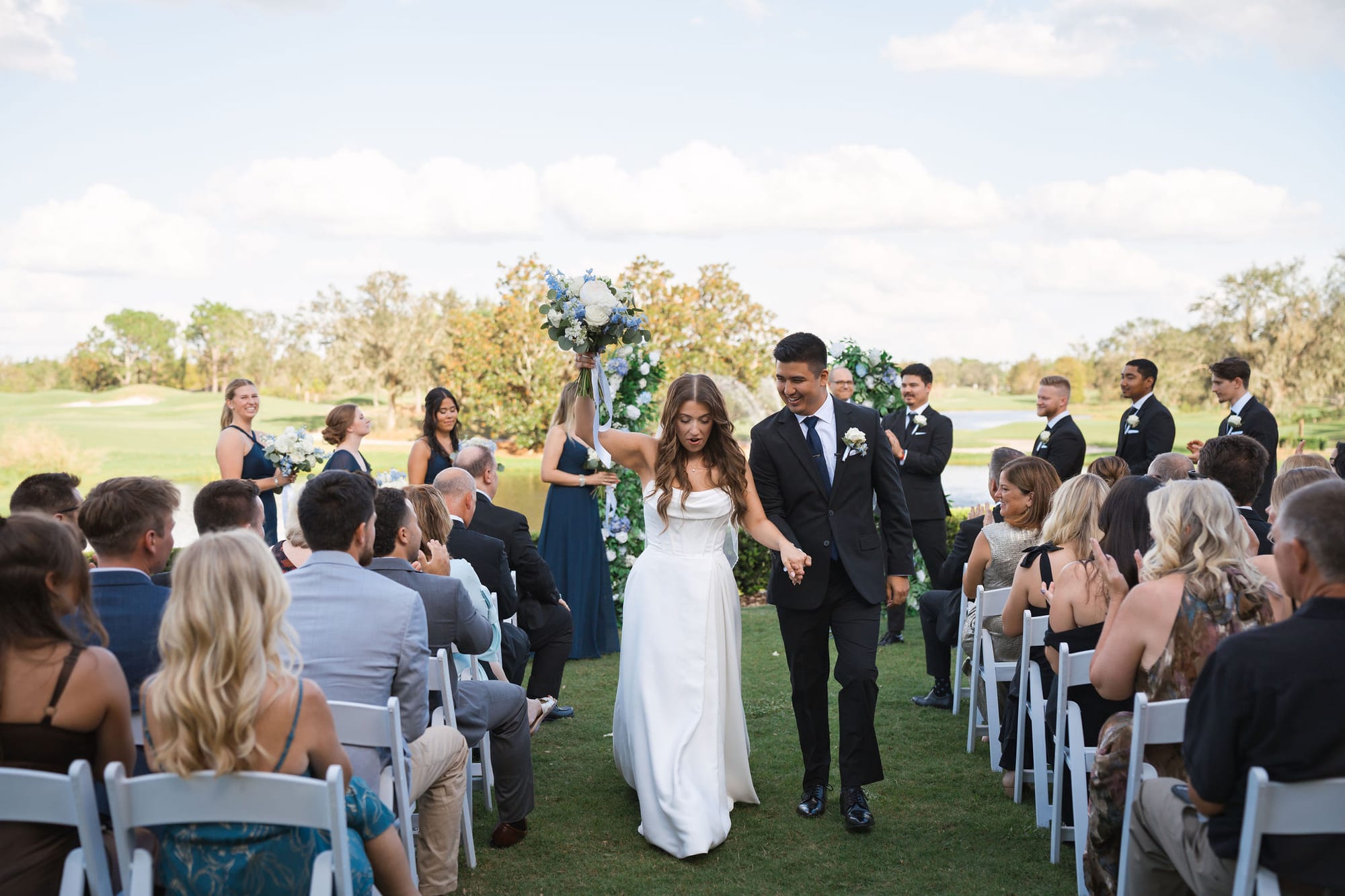 Newlyweds walking back up the aisle just after getting married