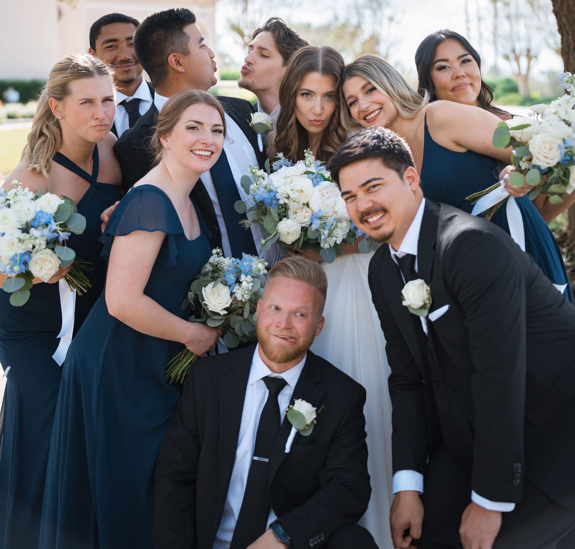 Wedding party celebrating together with the bride and groom