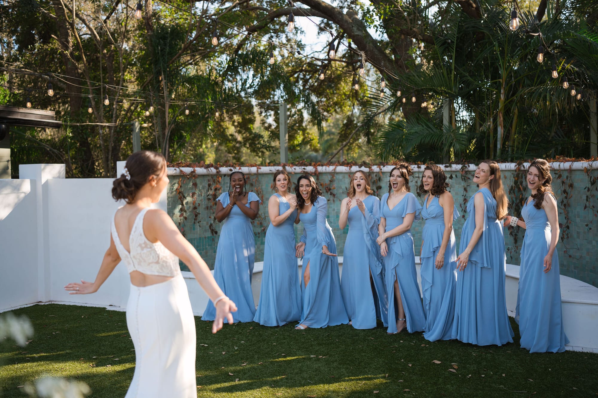 Bride twirling in her dress for her bridesmaids at SoireEstate
