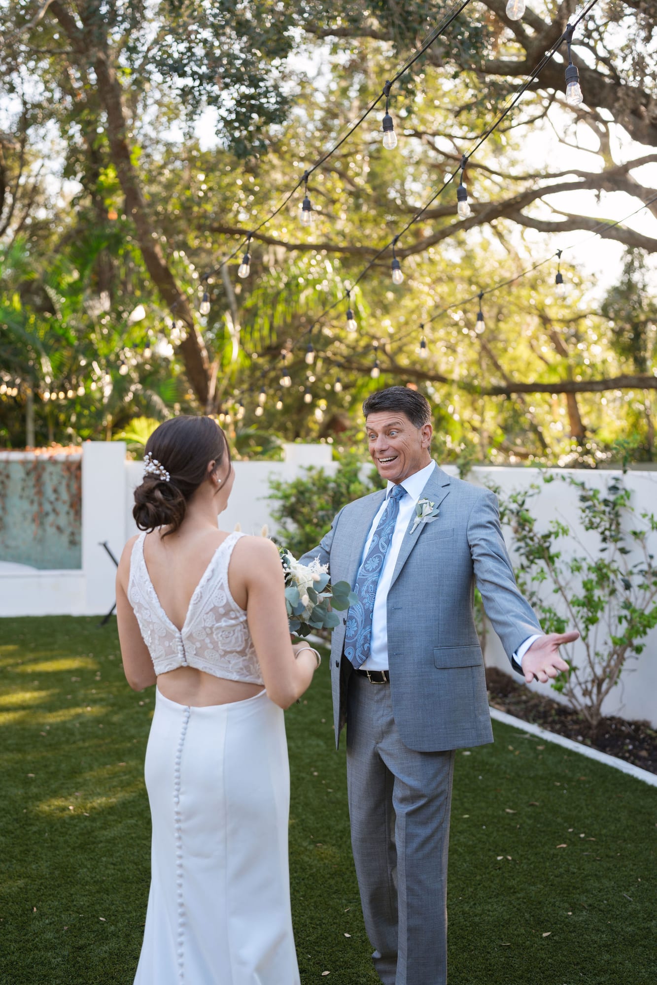 Father of the bride emotional as he sees his daughter in her wedding dress