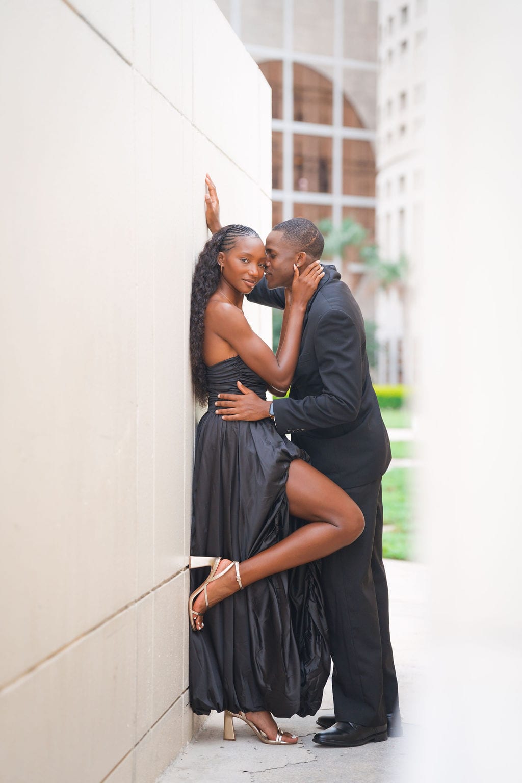 Couple embracing in a downtown Tampa alley during an engagement session